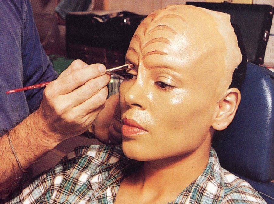 Behind-the-scenes photo from Star Trek: Voyager showing Roxann Dawson having her prosthetic makeup applied.
