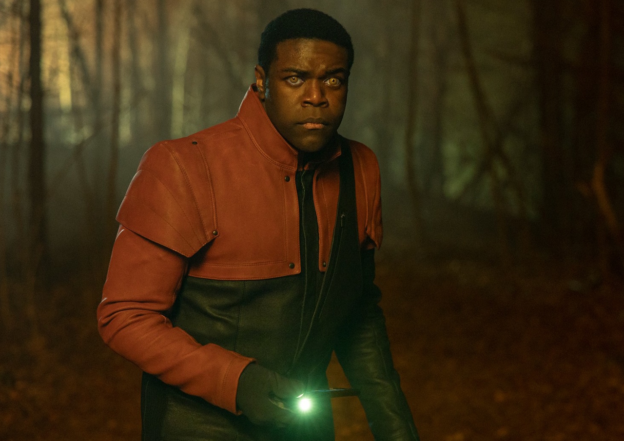 Promo photo from Star Trek: Section 31 (2025) showing Quasi the Chameloid holding a light.