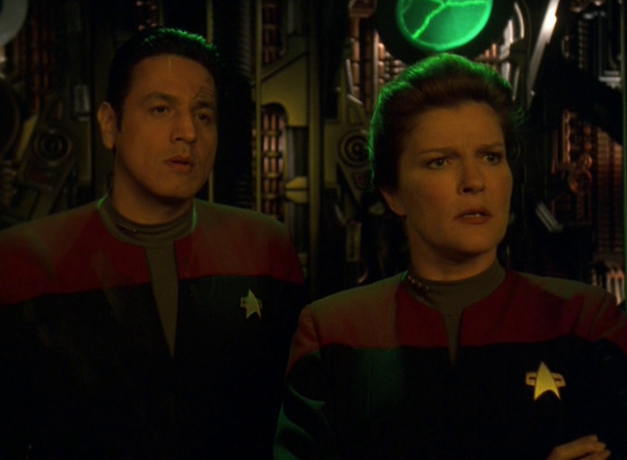 Still frame from Star Trek: Voyager showing Chakotay and Janeway in the assimilated cargo bay.