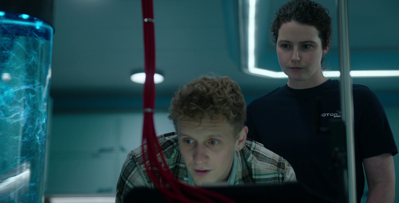 Still frame from The Rig Season 2 (2025) showing Askel and Heather.