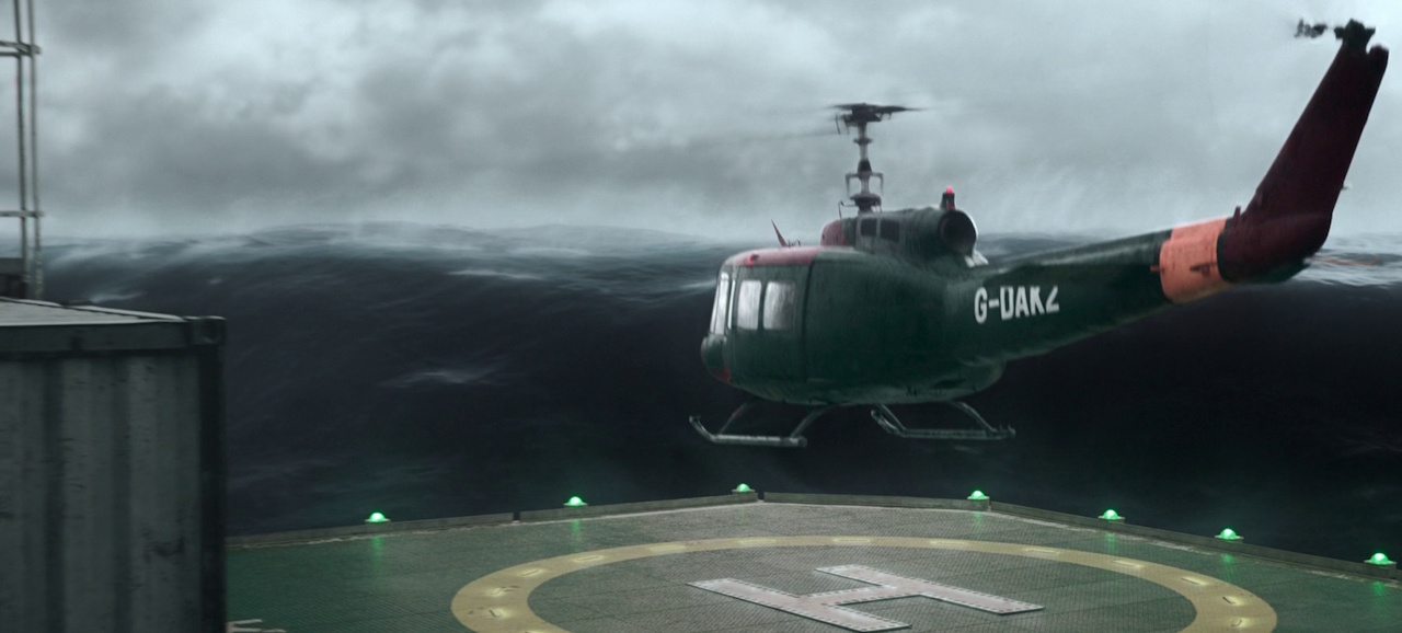 Still frame from The Rig Season 2 (2025) showing a helicopter taking off with a tsunami in the background.