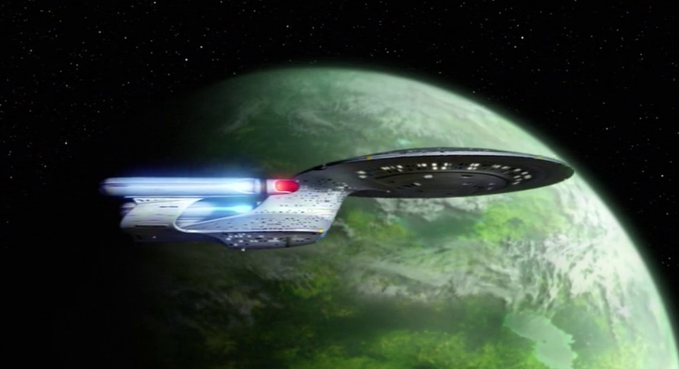 Still frame from Star Trek: The Next Generation showing the Enterprise-D in orbit of a green planet.
