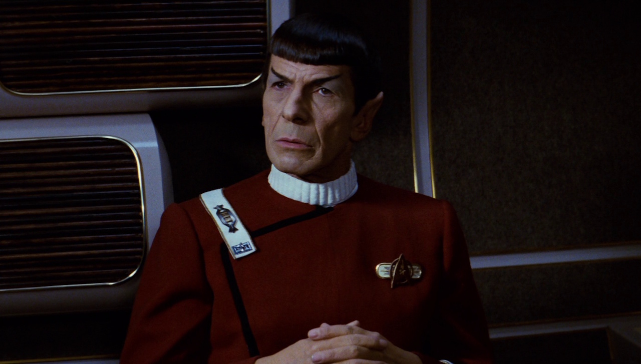 Still frame from Star Trek II: The Wrath of Khan showing Spock with his hands folded.