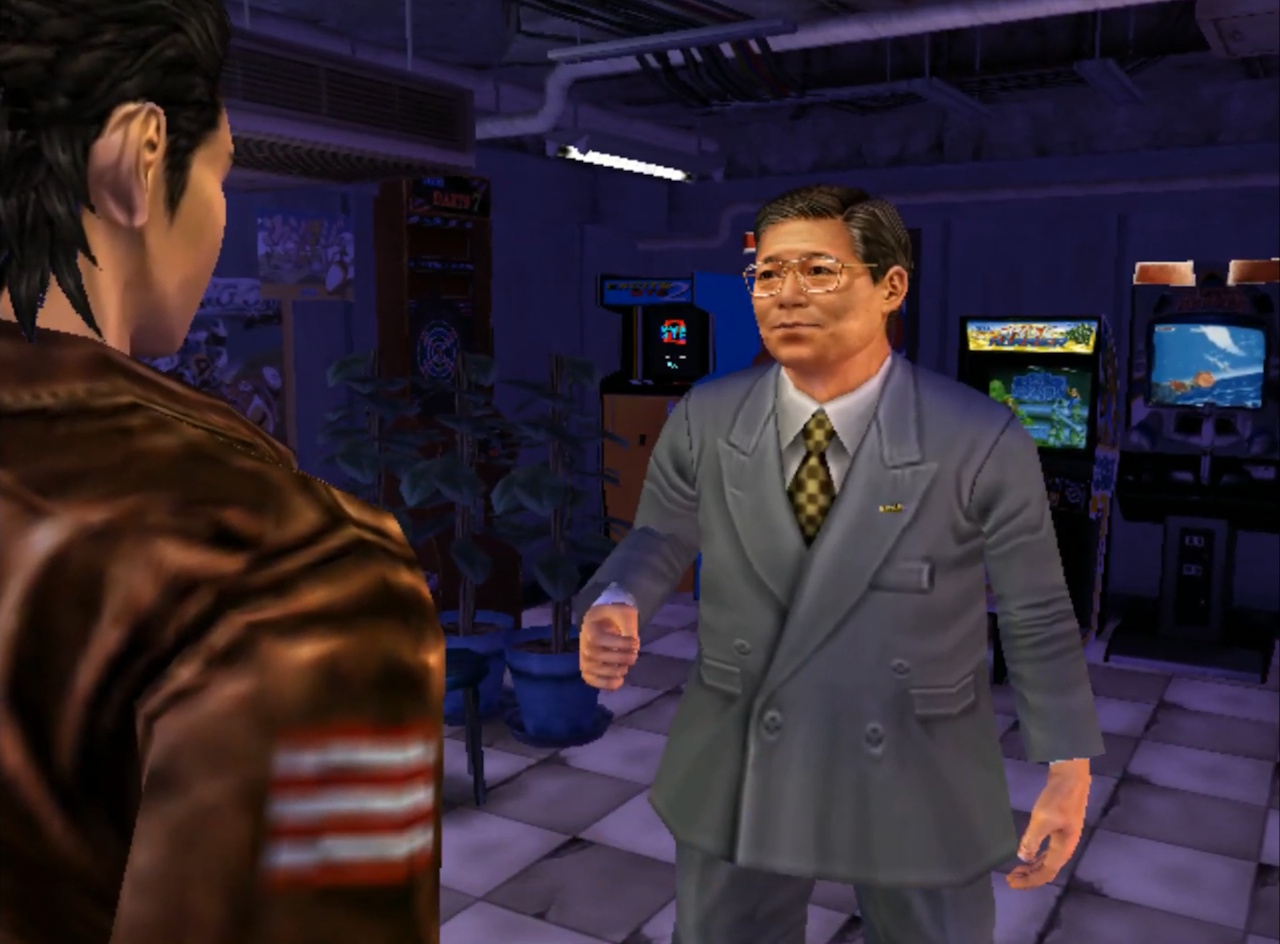 Screenshot of What Is Shenmue? showing Ryo and the Sega president in the arcade.