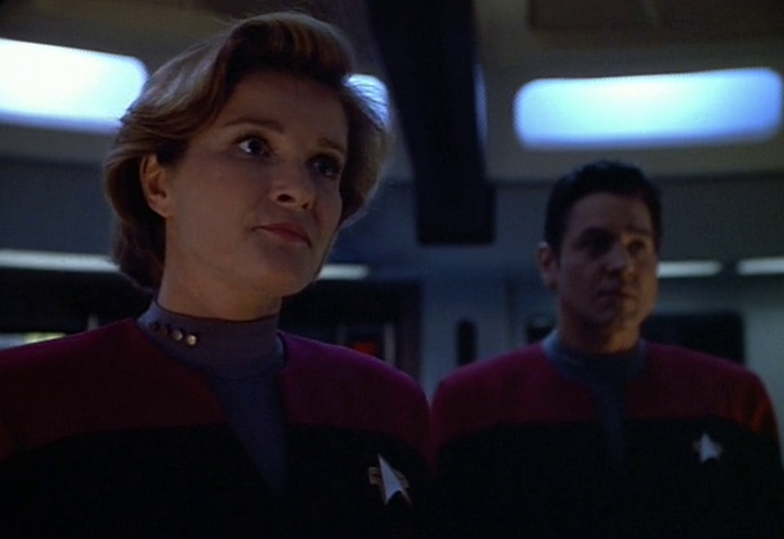 Still frame from Star Trek: Voyager showing Janeway and Chakotay on the bridge.