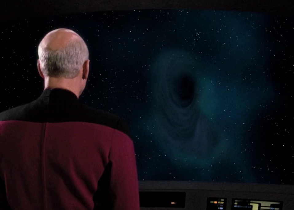 Still frame from Star Trek: The Next Generation showing Picard looking at an anomaly on the main viewscreen.