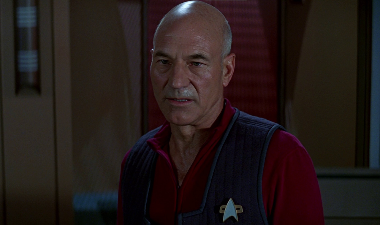 Still frame from Star Trek: First Contact showing Captain Picard on the bridge.