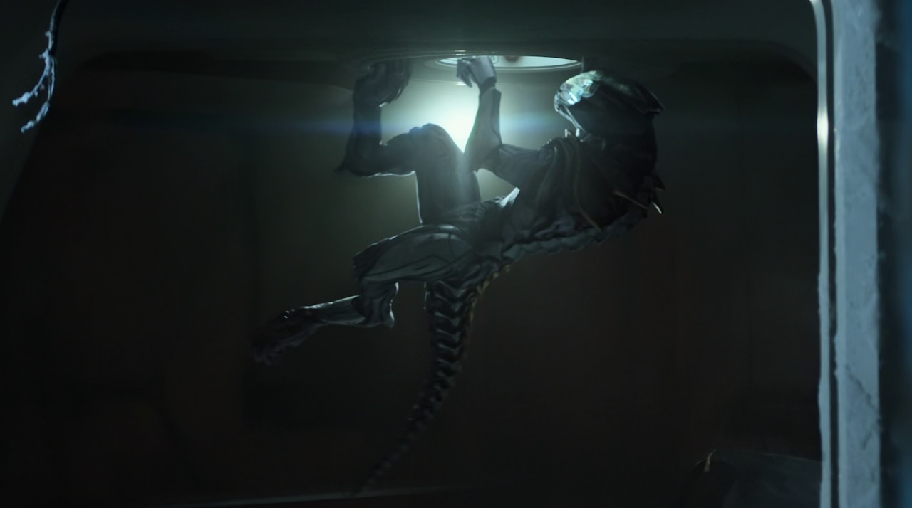 Still frame from Star Trek: Strange New Worlds Season 2 Episode 10 (2023) showing an adult Gorn trying to open a hatch.