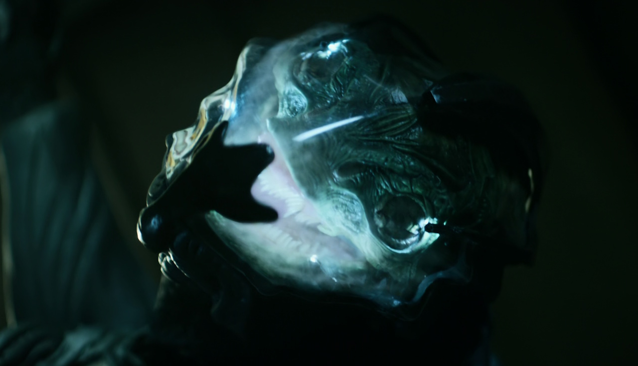 Still frame from Star Trek: Strange New Worlds Season 2 Episode 10 (2023) showing a Gorn wearing a helmet.