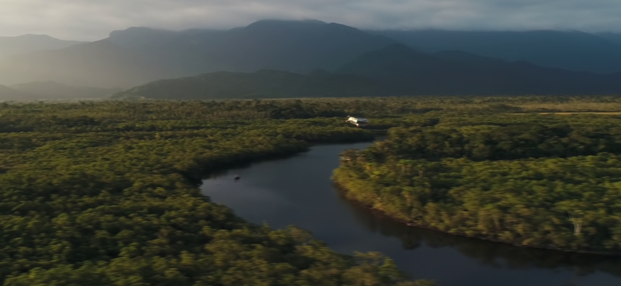 Still frame from Star Trek: Strange New Worlds Season 2 Episode 10 (2023) showing the landscape of Parnassus Beta with a shuttle flying above it.