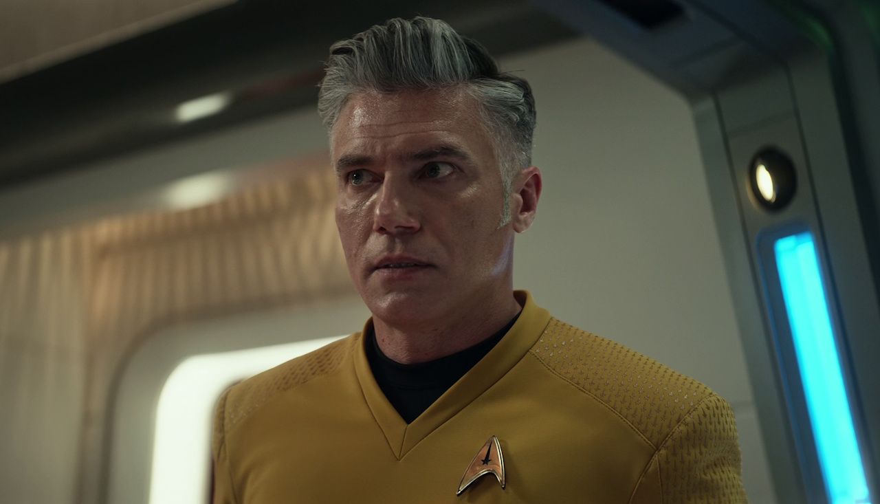 Still frame from Star Trek: Strange New Worlds Season 2 Episode 10 (2023) showing Captain Pike in uniform on the bridge.