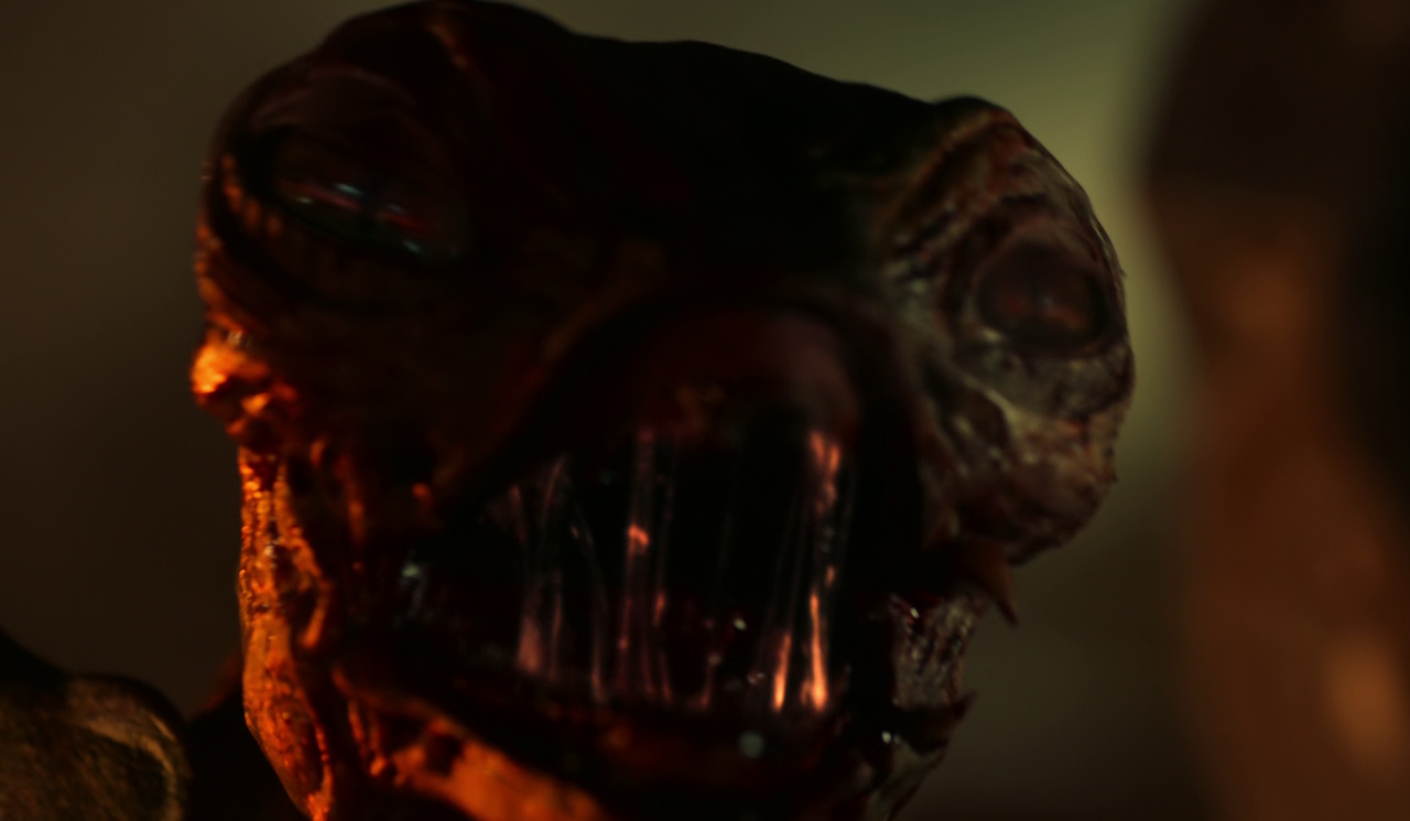 Still frame from Star Trek: Strange New Worlds Season 2 Episode 10 (2023) showing a close-up of a young Gorn.