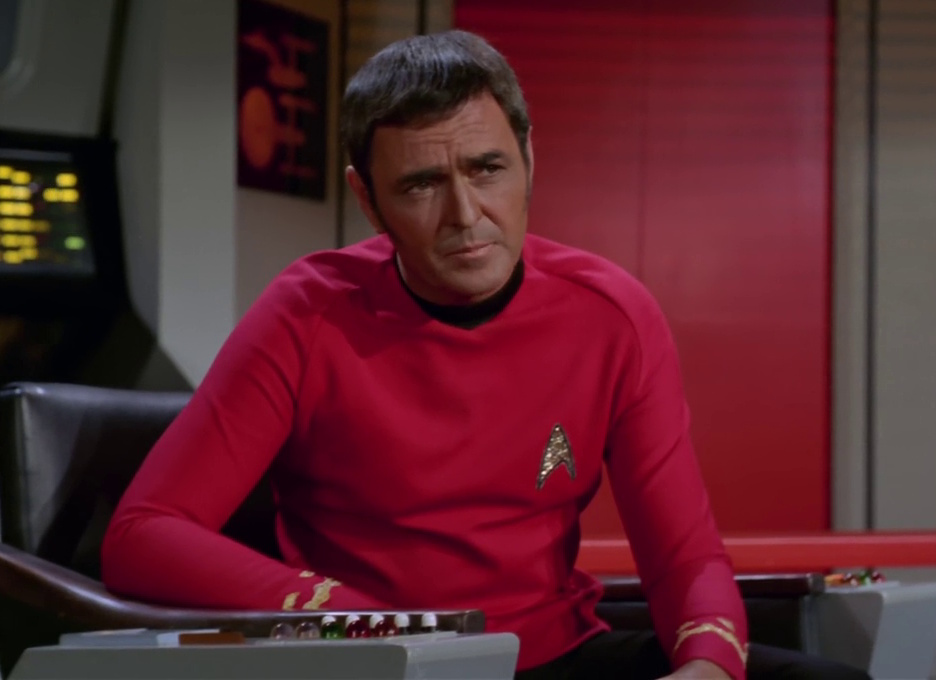 Still frame from Star Trek: The Original Series Season 3 showing Commander Scott in the captain's chair of the Enterprise.