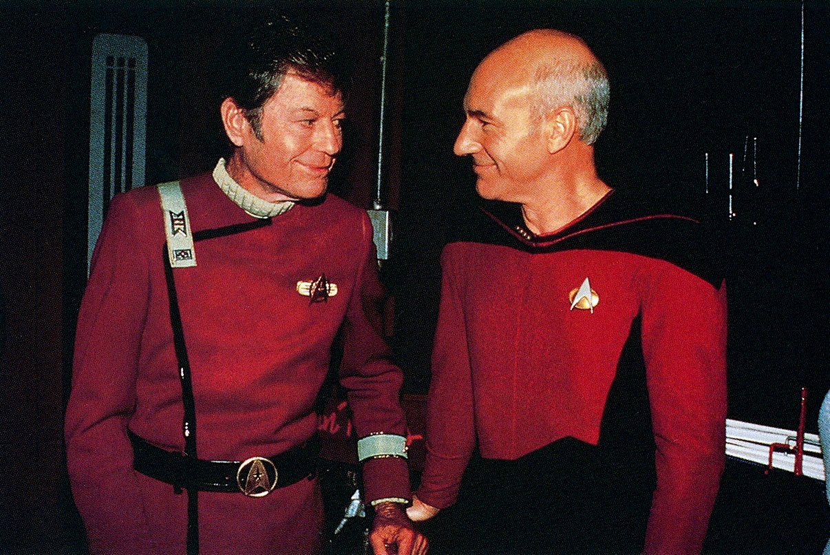 Behind-the-scenes photo from Star Trek showing Deforest Kelley with Patrick Stewart