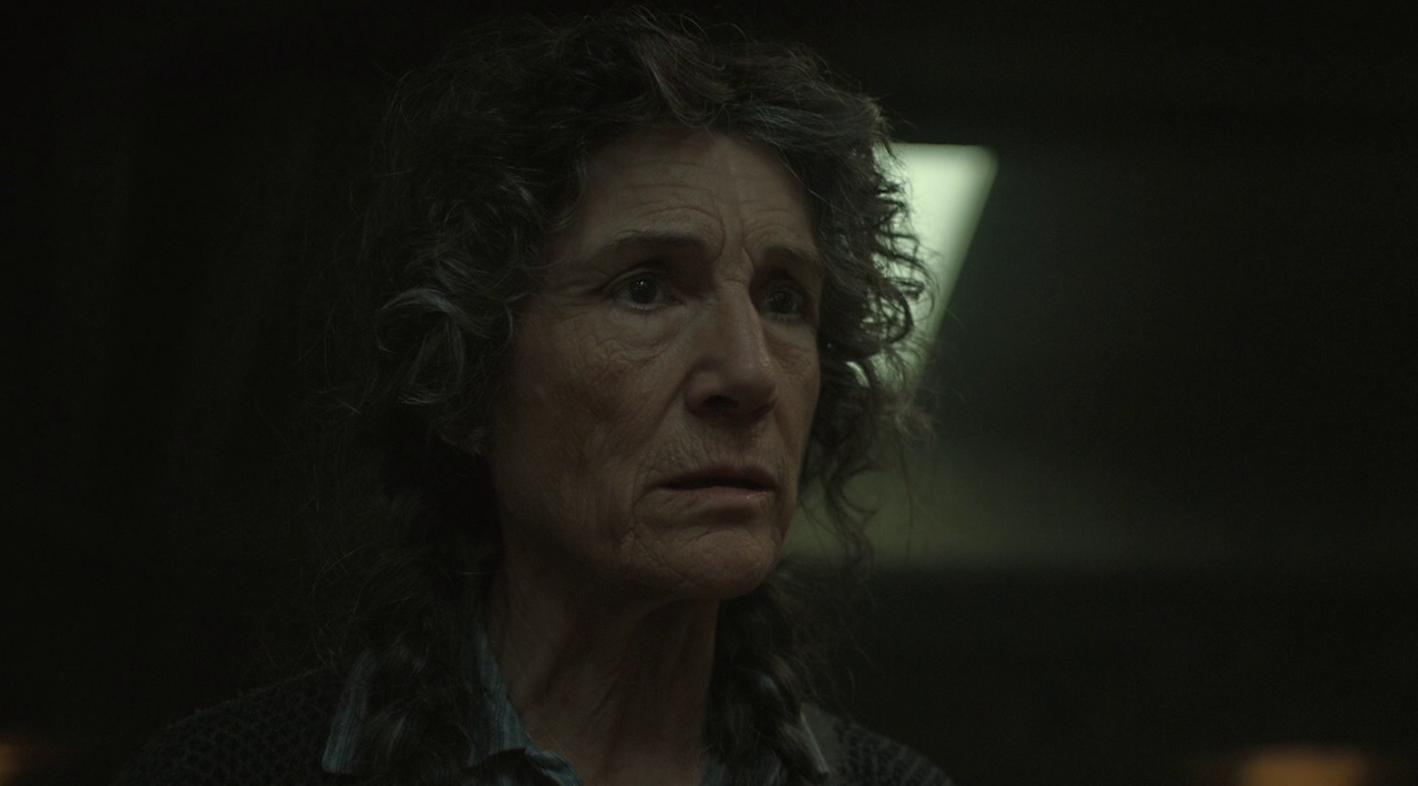 Still frame from Silo Season 2 (2024-25) showing a close-up of Walker.