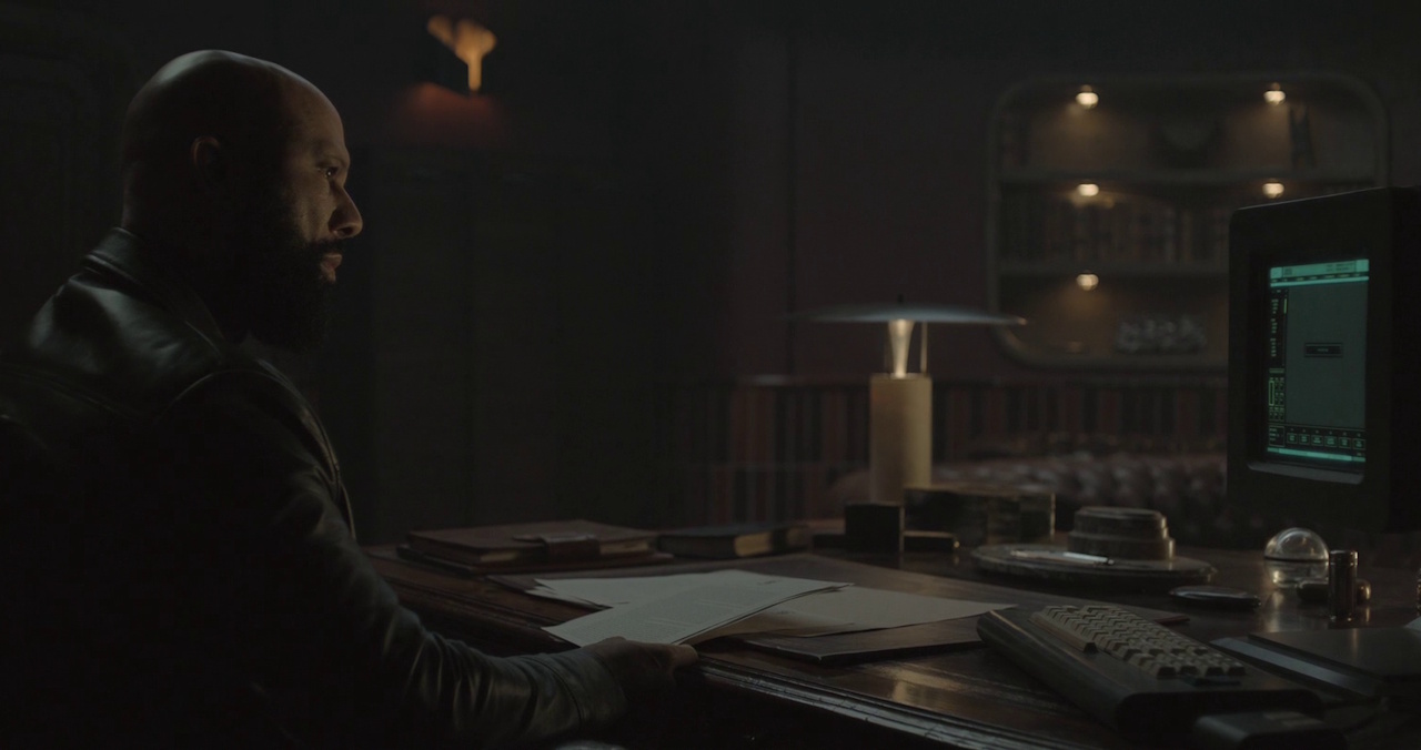 Still frame from Silo Season 2 (2024-25) showing Sims using a computer terminal.