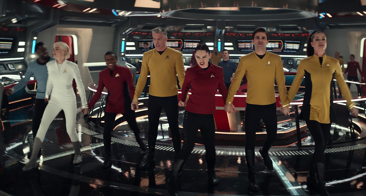 Still frame from Star Trek: Strange New Worlds Season 2 (2023) showing the main cast singing the final song of the episode.