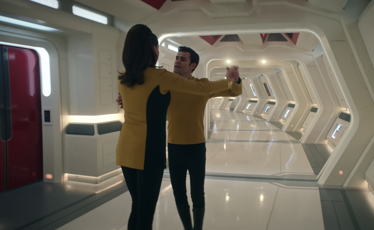 Still frame from Star Trek: Strange New Worlds Season 2 (2023) showing Kirk and Una dancing.