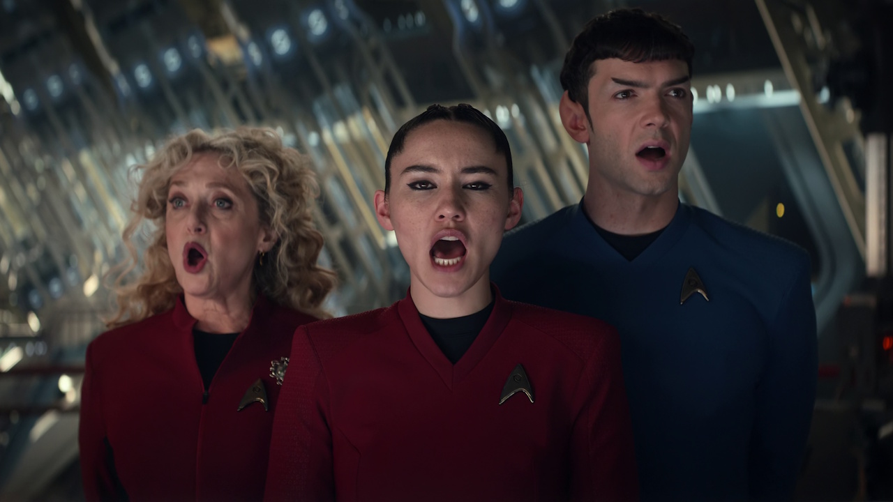Still frame from Star Trek: Strange New Worlds Season 2 (2023) showing Pelia, La'an, and Spock singing.