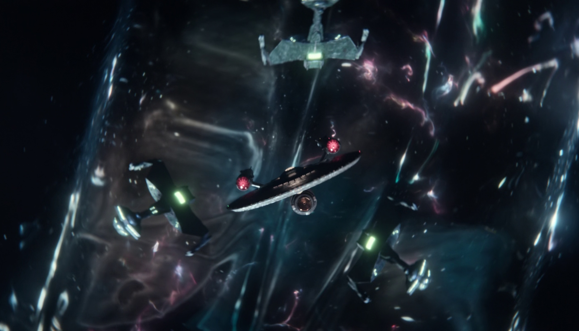 Still frame from Star Trek: Strange New Worlds Season 2 (2023) showing the USS Enterprise and three Klingon ships.