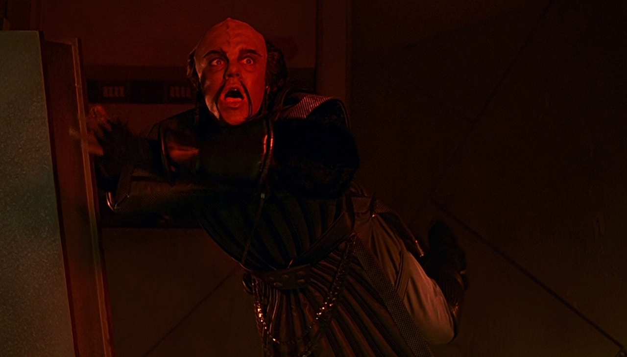 Still frame from Star Trek VI: The Undiscovered Country showing a Klingon floating helplessly.