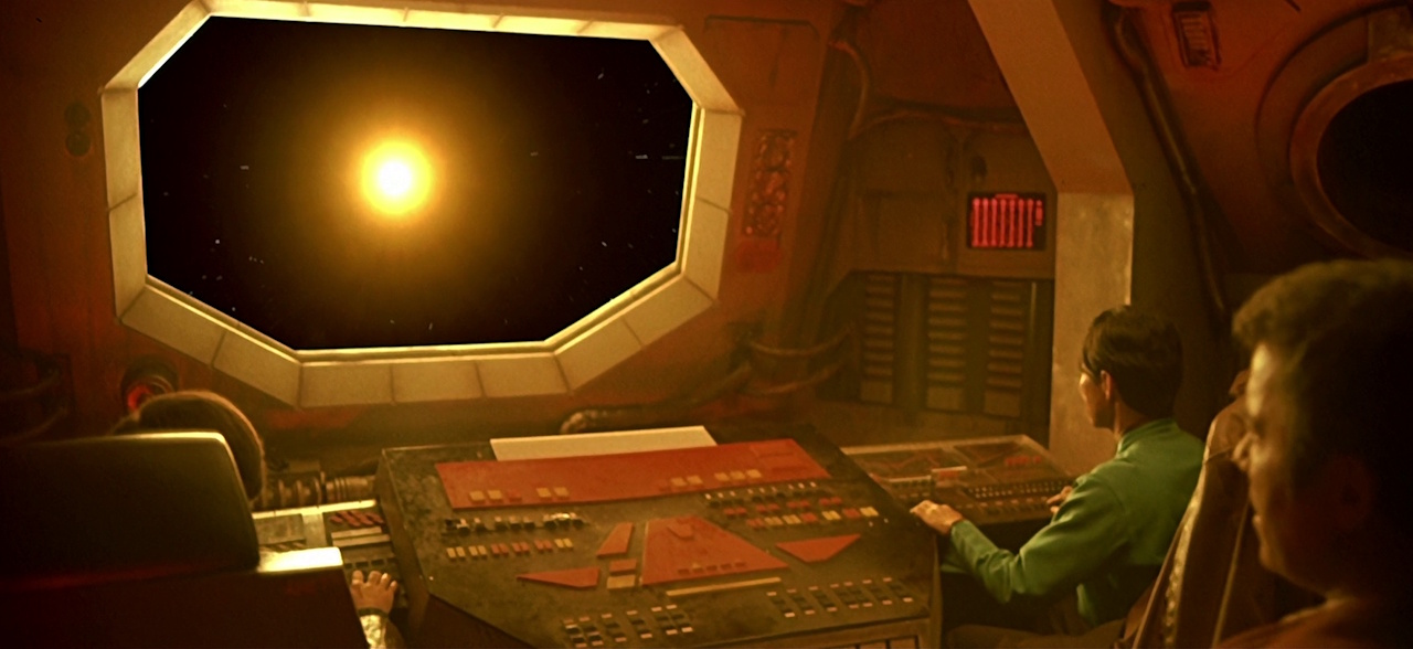 Still frame from Star Trek IV: The Voyage Home showing HMS Bounty approaching the sun.