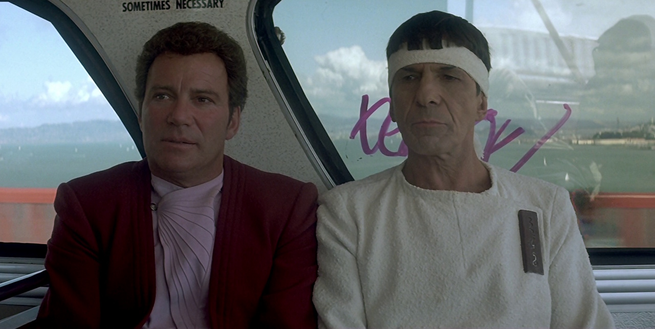 Still frame from Star Trek IV: The Voyage Home showing Kirk and Spock on a bus.