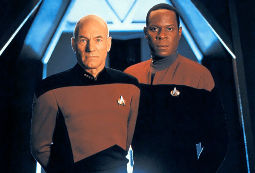 Promo photo for Star Trek: Deep Space Nine showing Sisko with Picard.
