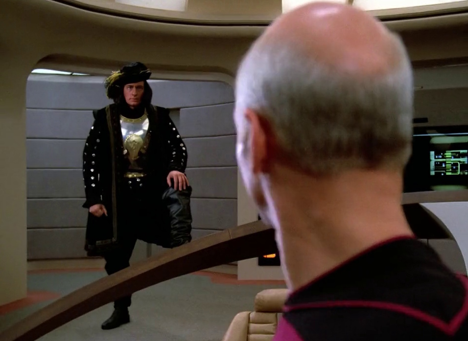 Still frame from Star Trek: The Next Generation Season 1 showing Picard meeting Q for the first time.