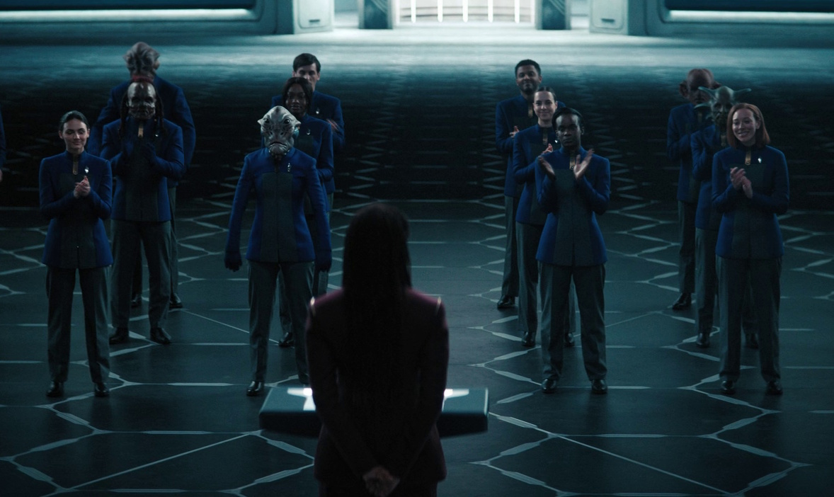 Still frame from Star Trek: Discovery Season 4 showing Captain Burnham addressing a group of cadets.