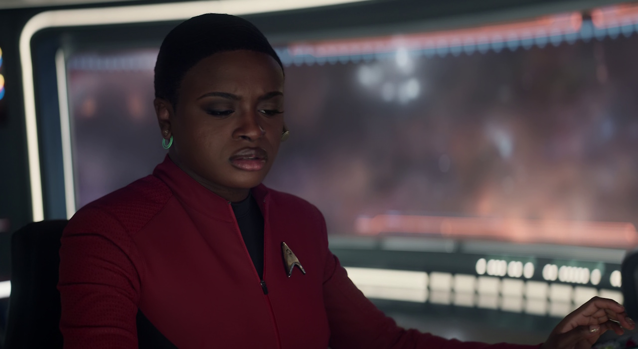 Still frame from Star Trek: Strange New Worlds Season 2 showing Uhura at her post.