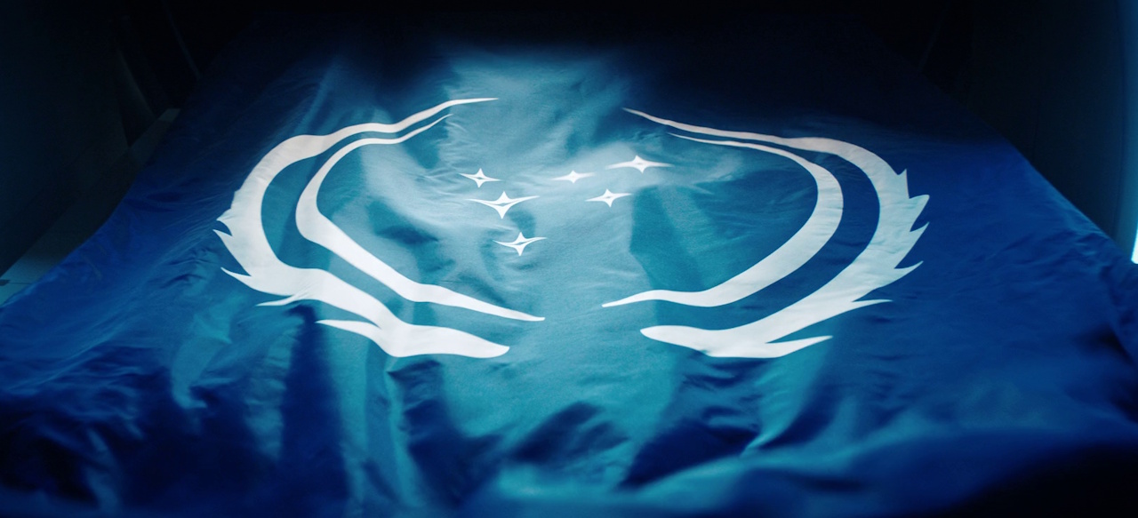Still frame from Star Trek: Discovery Season 3 showing the flag of the Federation.