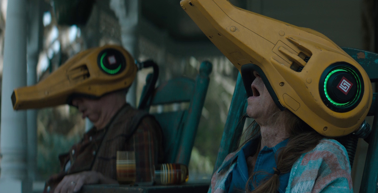 Still frame from The Electric State (2025) showing two people using neurocasters.