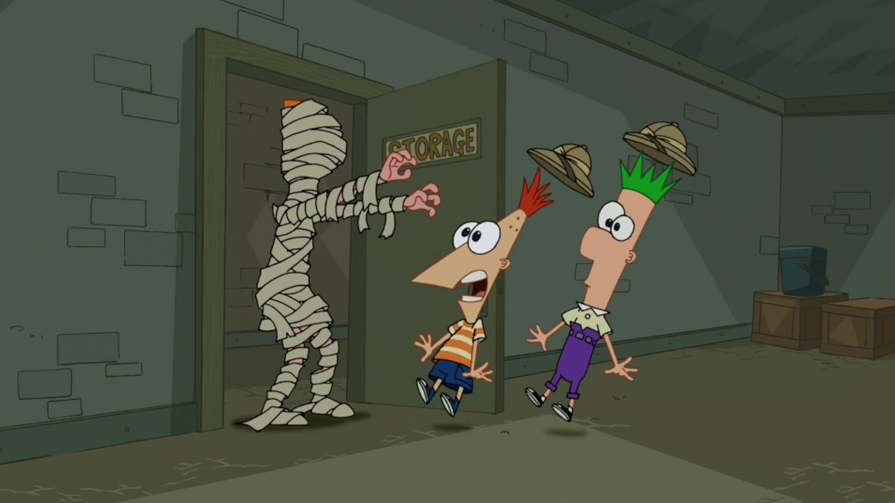 Still frame from Phineas and Ferb showing Phineas, Ferb, and Candace (in a mummy outfit).