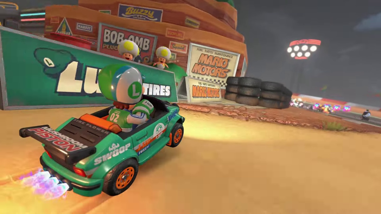 Still frame from the Mario Kart World Nintendo Direct broadcast showing Luigi racing on a desert track.
