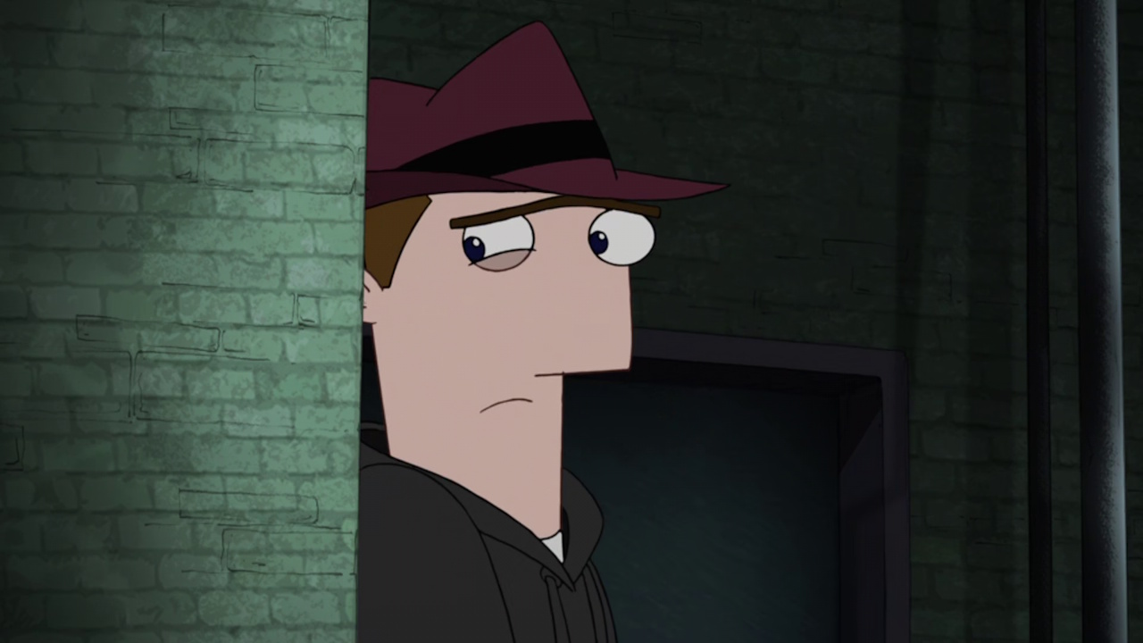 Still frame from Phineas and Ferb showing Monty hiding behind a wall.