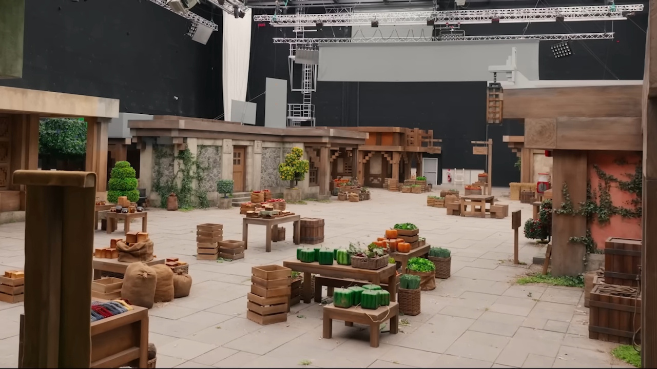 Behind-the-scenes photo from the set of A Minecraft Movie showing a marketplace.