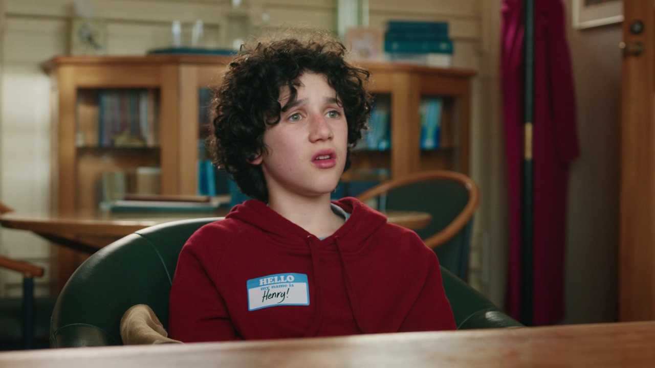 Still frame from A Minecraft Movie showing Henry in the principal's office.