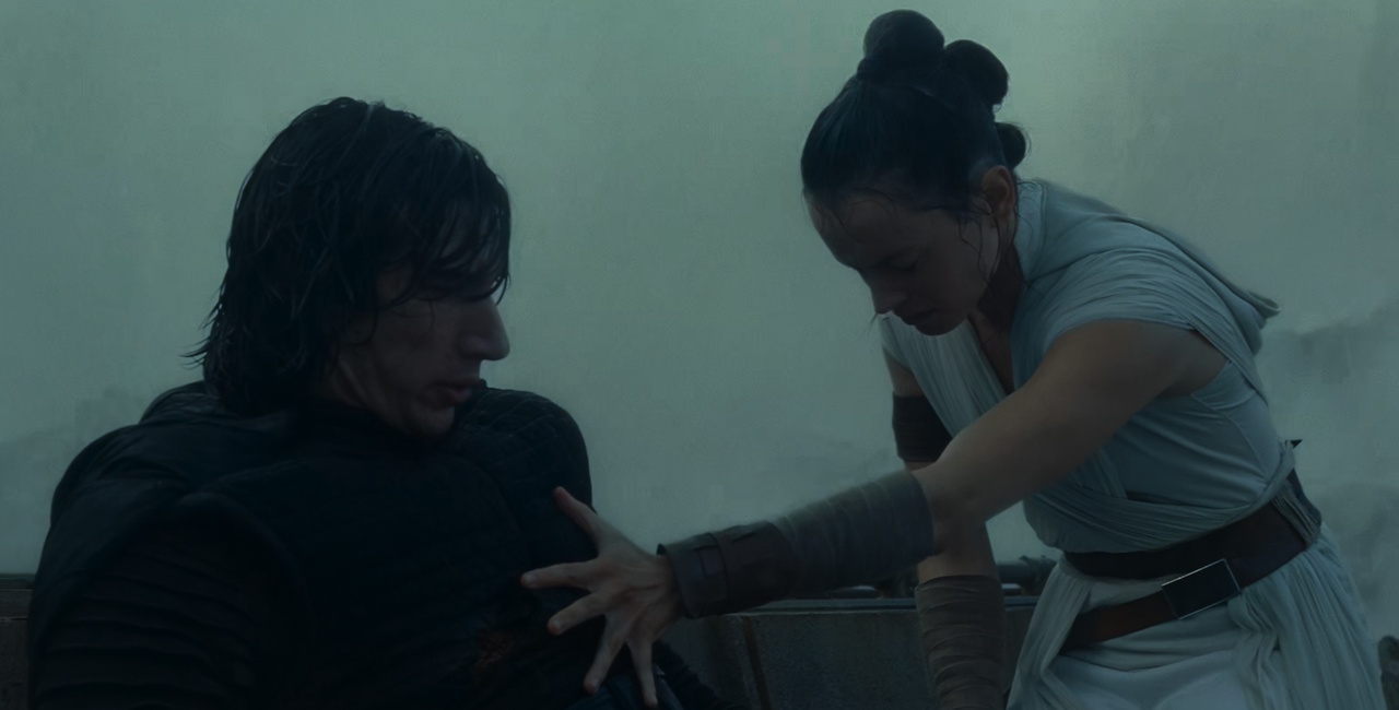Still frame from Star Wars: The Rise of Skywalker (2019) showing Rey attempting to heal Kylo.