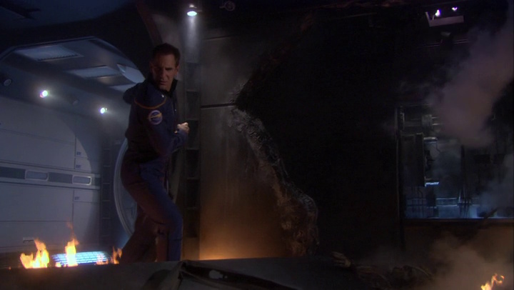 Still frame from Star Trek: Enterprise 4x26 showing holo-Archer in a damaged section of his ship.