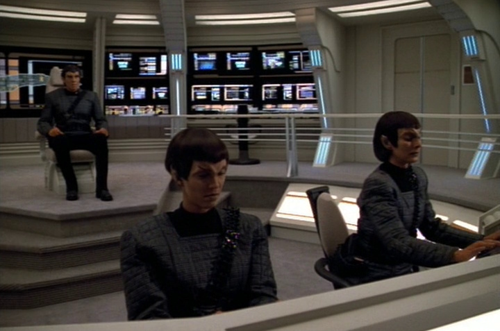 Still frame from Star Trek: Voyager showing three Romulans on the bridge of the Prometheus.