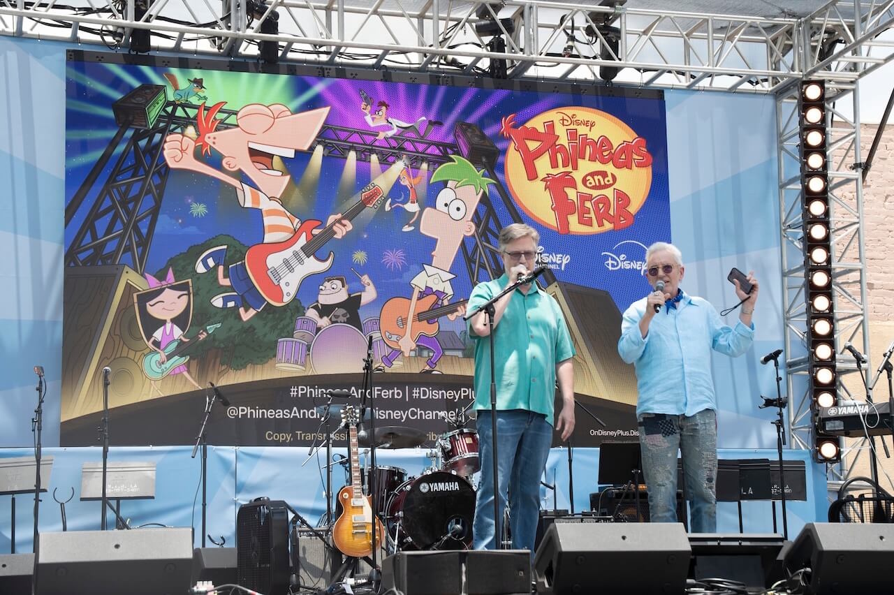 Photograph from the Phineas and Ferb S5 premiere showing the co-creators on stage.