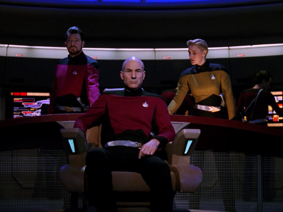 Still frame from Star Trek: The Next Generation showing Picard, Riker, and Yar in an alternate timeline.