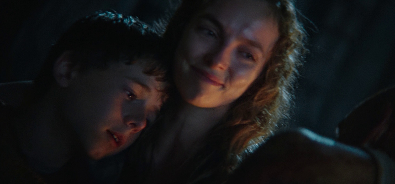 Still frame from 28 Years Later (2025) showing Spike and Isla with Dr Kelson.