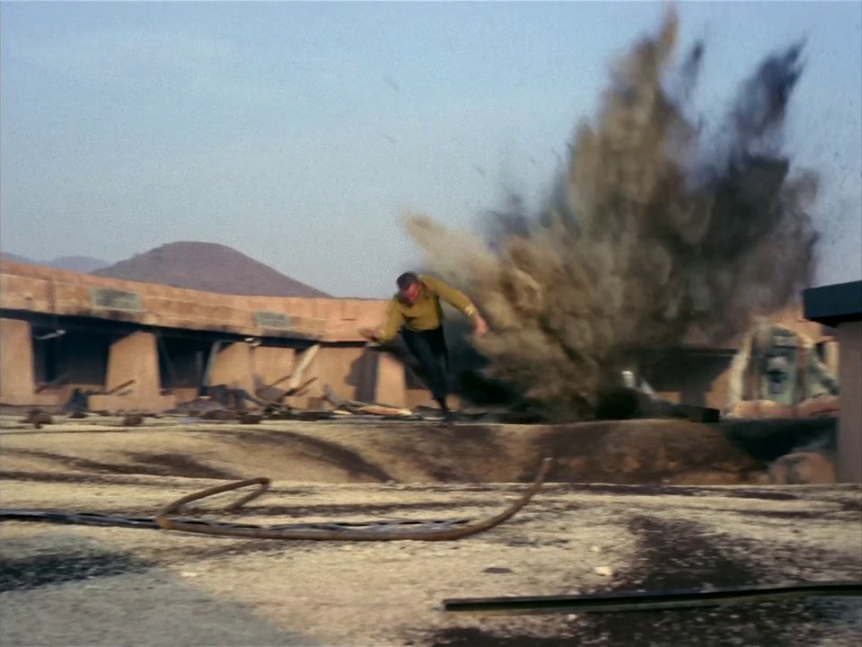Still frame from Star Trek: The Original Series Season 1 episode Arena, showing Kirk being flung into the air by an explosion.