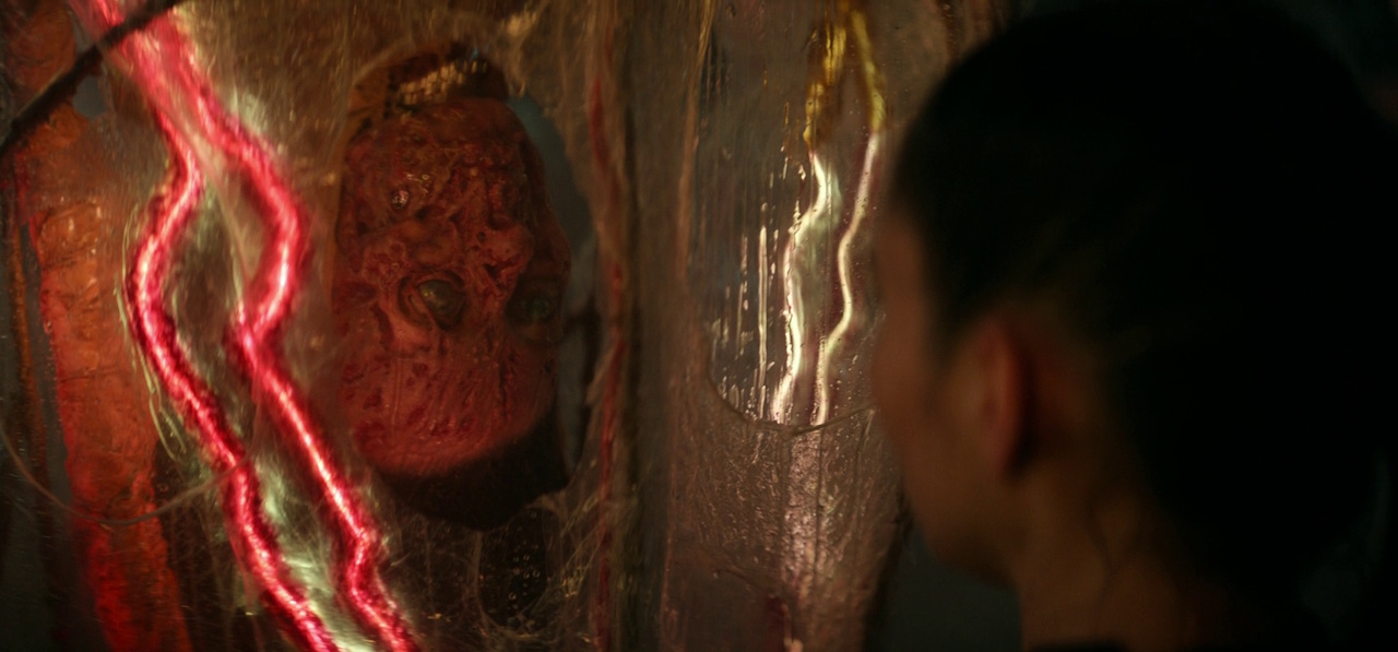Still frame from Star Trek: Strange New Worlds 3x01: Hegemony, Part II, showing La'an with a corpse.