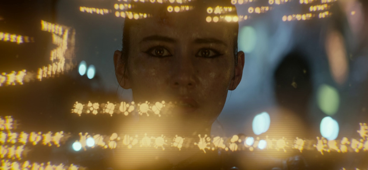 Still frame from Star Trek: Strange New Worlds showing La'an using a Gorn computer.