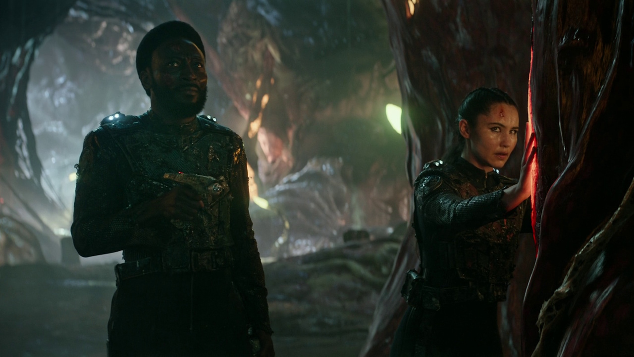 Still frame from Star Trek: Strange New Worlds 3x01: Hegemony, Part II, showing Dr M'Benga and La'an aboard the Gorn vessel.
