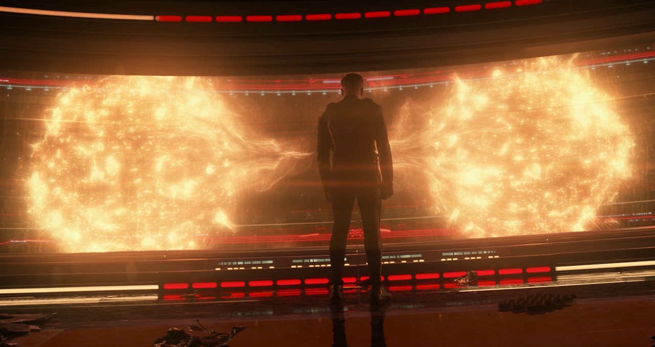 Still frame from Star Trek: Strange New Worlds 3x01: Hegemony, Part II, showing Captain Pike standing in front of the viewscreen, with two stars on the screen.