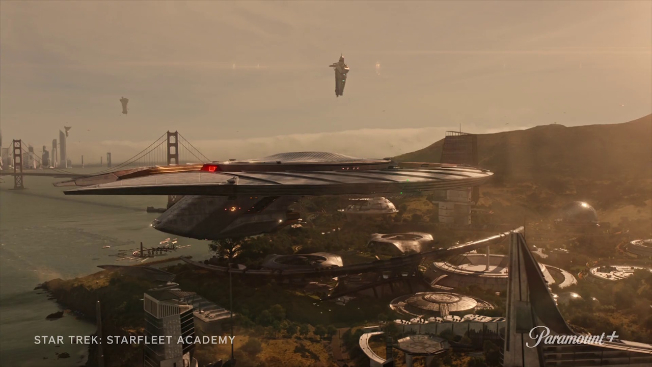 Still frame from the Star Trek: Starfleet Academy trailer showing the USS Athena (or another ship) hovering over the Academy.